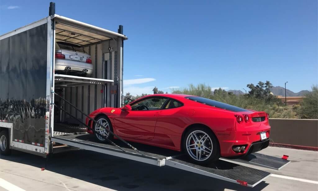 Red Ferrari 360 Coupe Getting Loaded into the Back of an Enclosed Car Trailer | National Transport Services