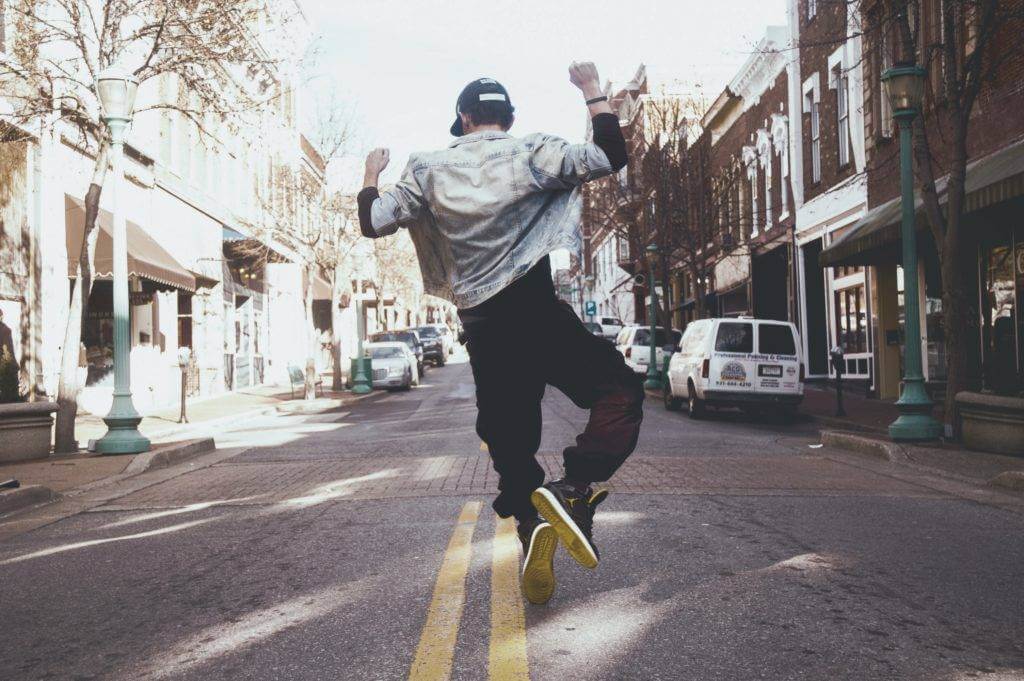 Man jumping with joy. Auto shipping.