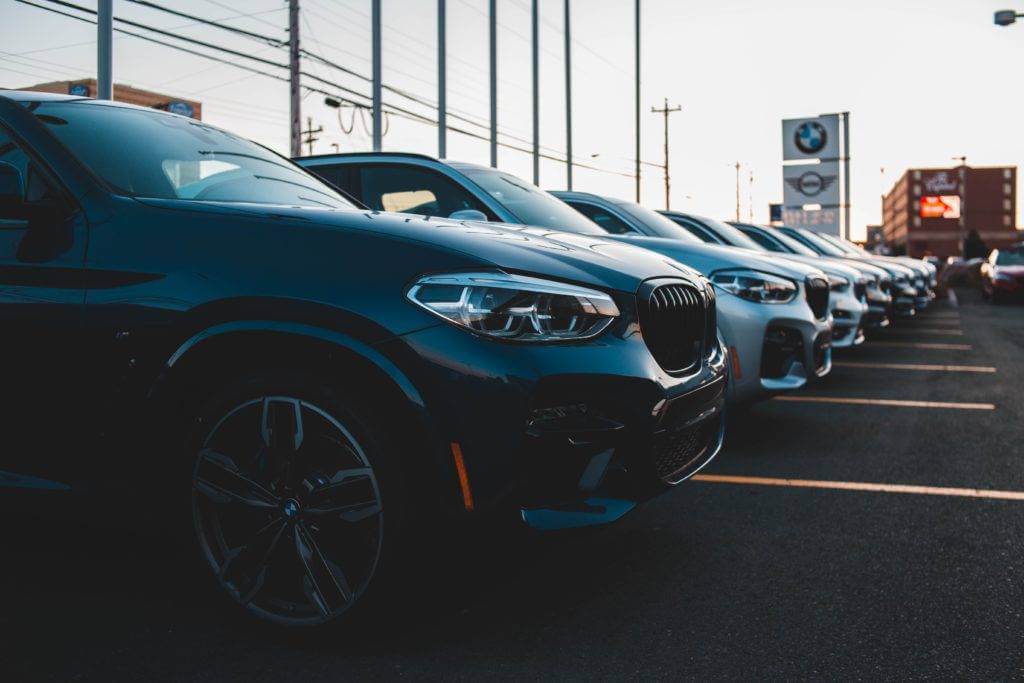 Cars parked on a car dealership lot. Dealership car transport.