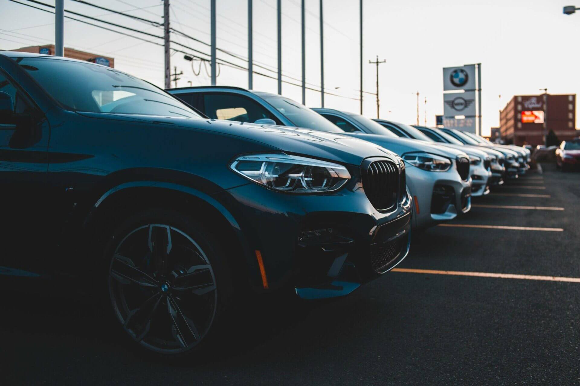 Cars parked on a car dealership lot. Dealership car transport.