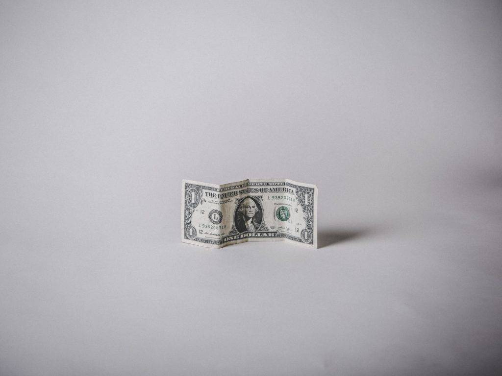 A single dollar bill. Cheapest Car Shipping