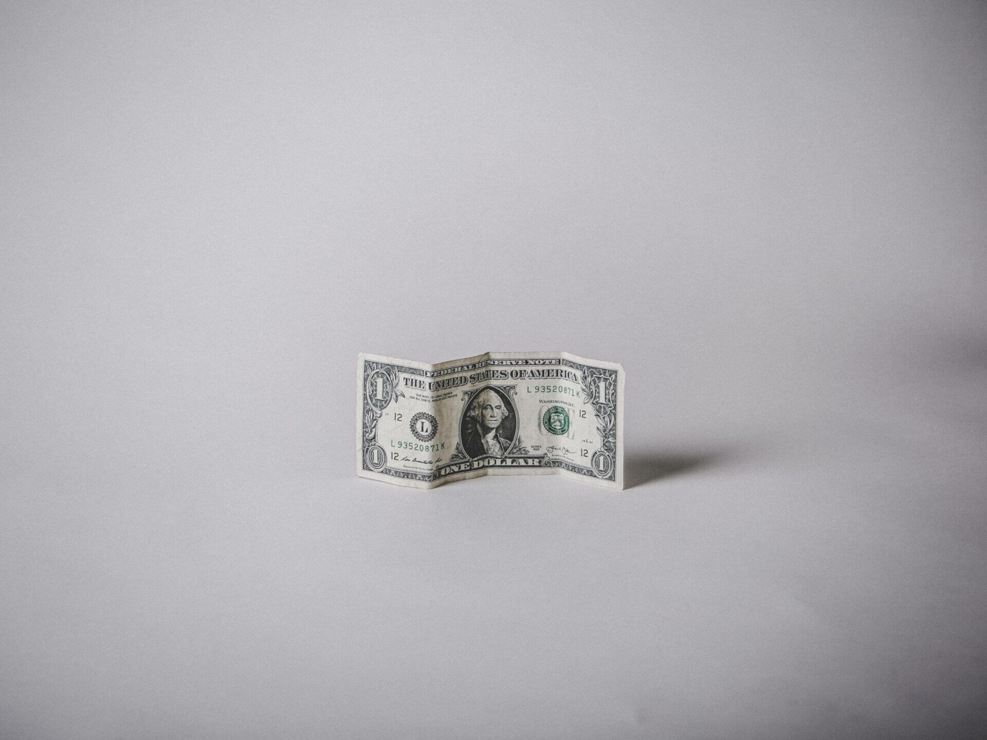 A single dollar bill. Cheapest Car Shipping