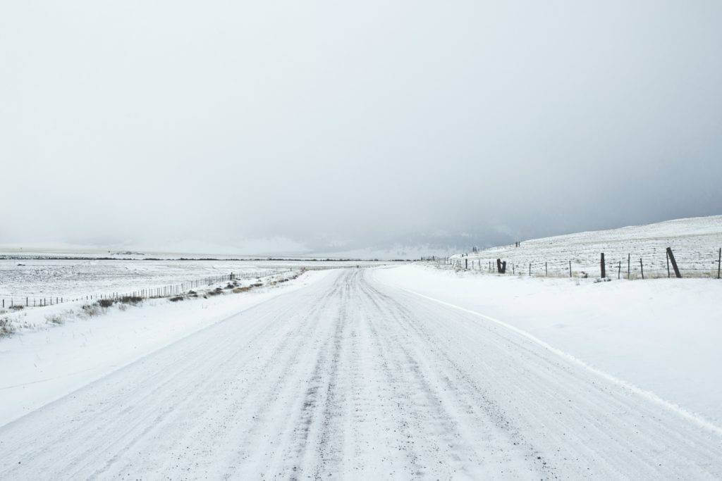 An open road with heavy snow.