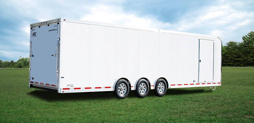 A white two car enclosed trailer.