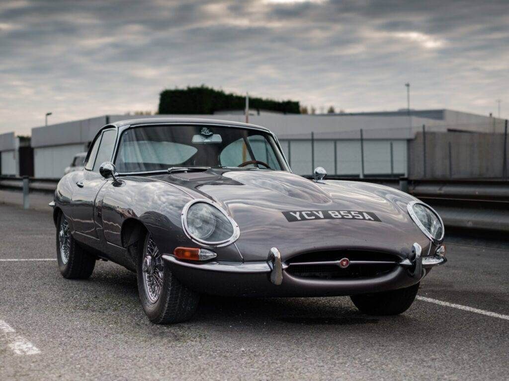 A fully restored Jaguar E-Type FHC Series I in Gunmetal Grey.